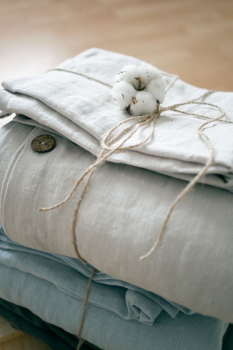Folded linen in grey-blue tones, tied with twine